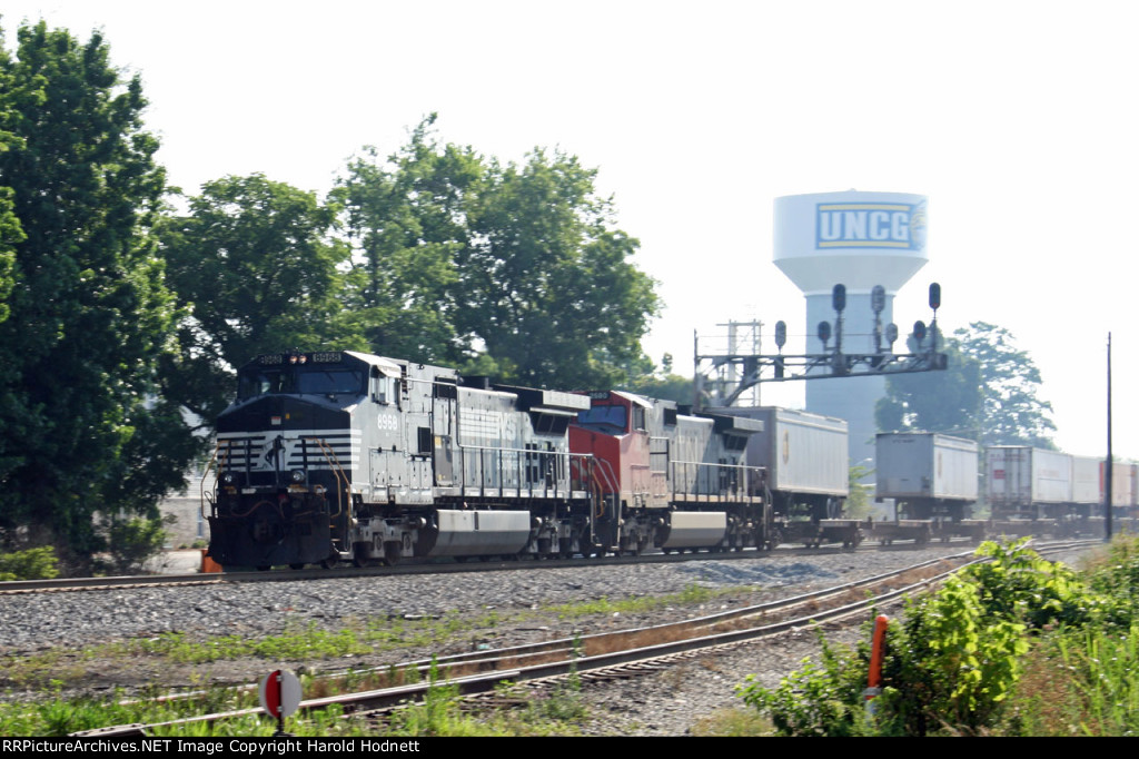 NS 8968 leads train 218 racing past the signals at Aycock